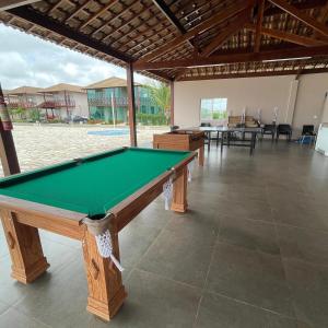 a pool table in a room with two tables at Carnaval 2026 in Tamandaré