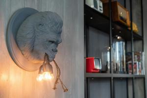 a statue of a head hanging on a wall at Motel One Berlin-Spittelmarkt in Berlin +38 photos