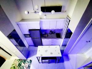 an overhead view of a kitchen with a white table at Loft VIP in Naama bey in Sharm El Sheikh +17 photos