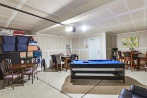 a room with a pool table and a dining room at Pool Table & Patio! Spacious Merced Getaway in Merced