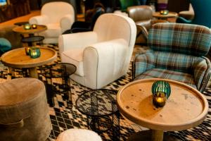 a room with tables and chairs and chairs at Motel One Glasgow in Glasgow +19 photos