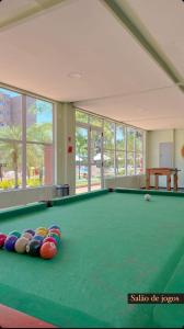 a billiard room with a green pool table at Gran Lençóes Flat Residence in Barreirinhas