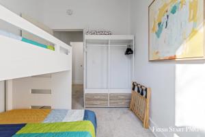 a bedroom with a bunk bed and a closet at City View Loft in Saint Joseph
