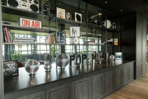 a counter in a store with vases on it at Motel One Mannheim in Mannheim
