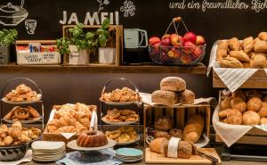 a bakery with different types of bread and pastries at Motel One Stuttgart-Bad Cannstatt in Stuttgart