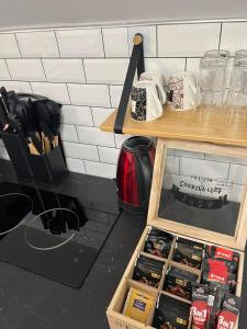 a kitchen counter with a drawer full of knives at Crassula Lux 4 in Surčin