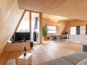 a living room with a couch and a table at Panorama Loft in Wörgl