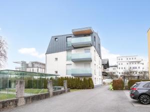 a building with a car parked in front of it at Panorama Loft in Wörgl