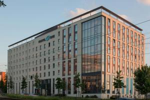 a large office building with a lot of windows at Motel One Stuttgart-Feuerbach in Stuttgart