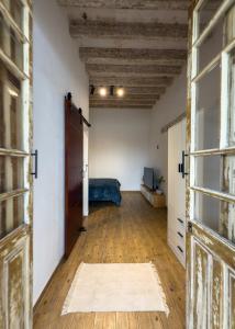 an empty room with a door and a bedroom at Casa Bravo in Toluca +9 photos
