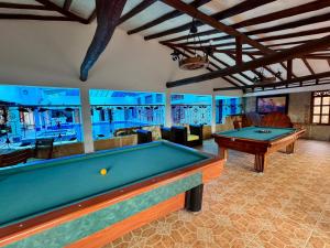 a billiard room with two pool tables in it at Hotel Bosque de la Villa in Villa de Leyva