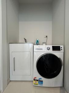 a microwave and a refrigerator in a kitchen at Star View in Lake Tekapo