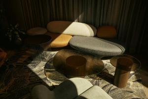 a living room with three chairs and a table at The Cloud One Gdansk in Gdańsk +35 photos