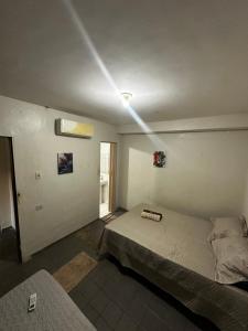 a bedroom with a bed in a room at 3R acomodações in Juazeiro do Norte
