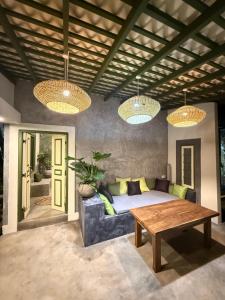 a living room with a couch and a table at Wanora Eco Villa in Dickwella
