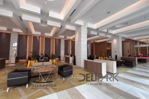 a lobby of a hotel with chairs and a table at SheepDream 18DS DeliparkMall 2Bedroom, 1Bathroom in Medan +93 photos