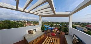 a balcony with a view of a city at Rooftop View Home in Kampot
