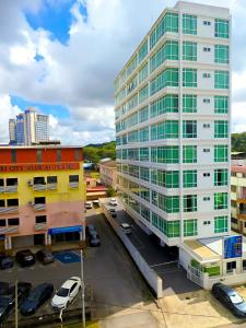 an aerial view of a tall white building at New Palace Inn in Miri