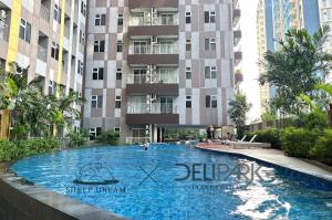 a large swimming pool in front of a building at SheepDream 17BC DeliparkMall 2Bedroom, 1Bathroom in Medan +77 photos
