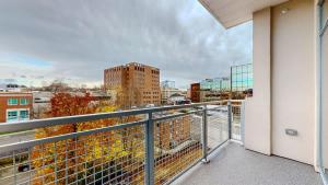 a balcony with a view of a city at Stylish Home With Free ParkingZA in Stamford