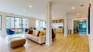 a living room with a couch and a table at Stylish Home and Cozy in Stamford