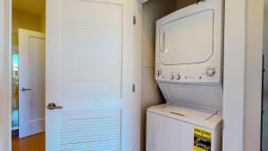 a white washer and dryer in a laundry room at Great Charming stay in Stamford
