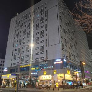 a large building at night in a city at ValueStay Hotel 9A in Seoul