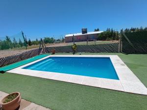 an empty swimming pool on a tennis court at Casa de campo in Puerto Madryn