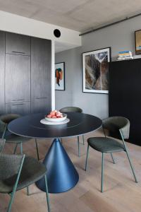 a dining room with a black table and chairs at Eastlake Retreat Kingston in Kingston 