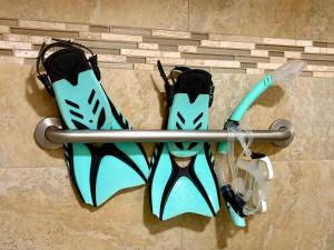 a pair of shoes hanging on a wall at Compass Blue Lahaina in Lahaina