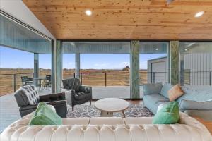 a living room with a couch and chairs at Blue Hills Ranch in McGregor