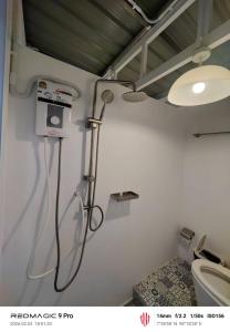 a bathroom with a shower and a toilet at Sleep On The Clouds in Ban Kata +16 photos