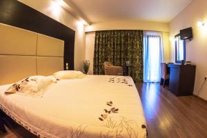 Postel nebo postele na pokoji v ubytování Giotis Boutique Hotel