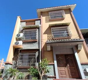 a building with balconies on the side of it at 春栖客栈 in Chuanxingpu