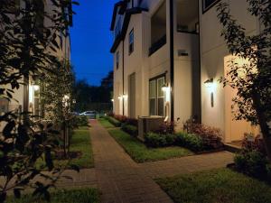 a walkway between two buildings at night at 5 mins to NRG and The Medical Center The Houston Reston in Houston
