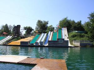 a group of ramps in a body of water at Chalet 8 Pers - Terrasse - Equipement bébé - API-1-52-1519 in Beaudreix +22 photos