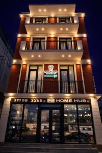 a store front of a home hub at night at Stylish House in Kutaisi