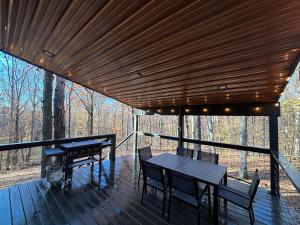 a wooden deck with a table and chairs on it at Eagles Rest in Murray
