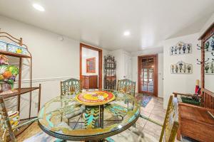 a dining room with a glass table and chairs at Twin Fawns - EV #3417 in Estes Park