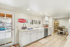 a kitchen with a cocacola sign on the wall at Twin Fawns - EV #3417 in Estes Park