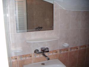 a bathroom with a sink and a mirror at Hotel Babeva in Sveti Vlas +49 photos