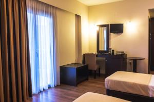 Postel nebo postele na pokoji v ubytování Giotis Boutique Hotel