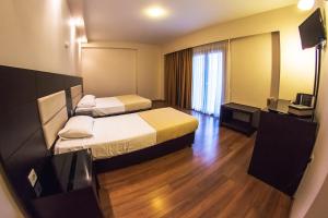 Postel nebo postele na pokoji v ubytování Giotis Boutique Hotel