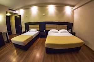 Postel nebo postele na pokoji v ubytování Giotis Boutique Hotel