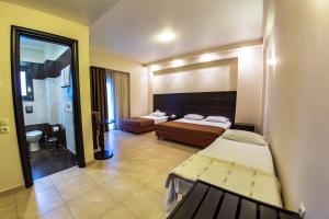 Postel nebo postele na pokoji v ubytování Giotis Boutique Hotel