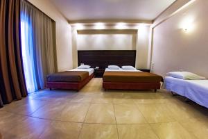 Postel nebo postele na pokoji v ubytování Giotis Boutique Hotel