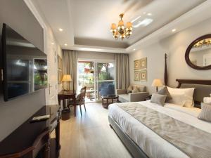 a bedroom with a large bed and a living room at Moustache Mussoorie in Mussoorie