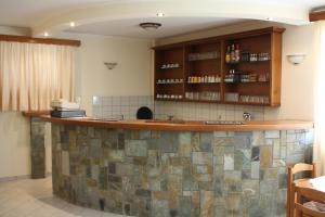 a kitchen with a large counter in a room at Domus Inn in Ioannina