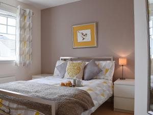 a bedroom with a bed with a teddy bear on it at The Marches in Anstruther +7 photos