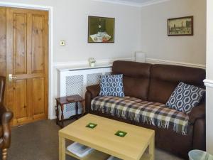 a living room with a couch and a coffee table at Bank View in Settle